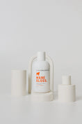 Load image into Gallery viewer, dog shampoo on white styled background