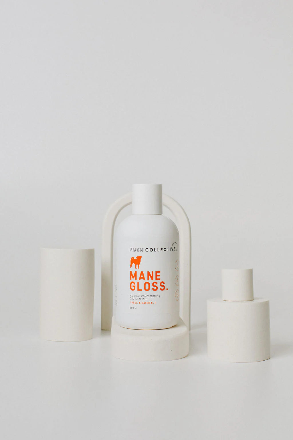 dog shampoo on white styled background 