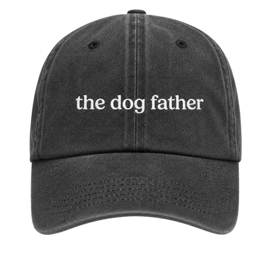 Black cap with 'the dog father' text on a white background