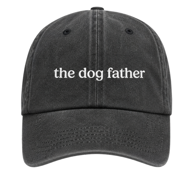 Black cap with 'the dog father' text on a white background