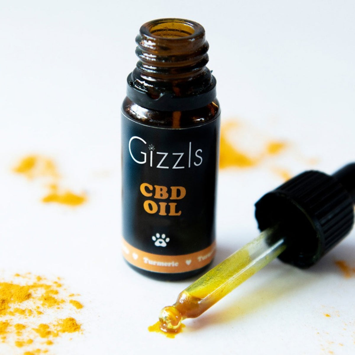 Gizzls CBD oil with turmeric bottle and dropper for dogs