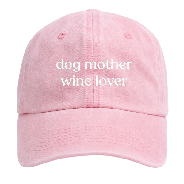 Pink cap with 'dog mother wine lover' text on a white background